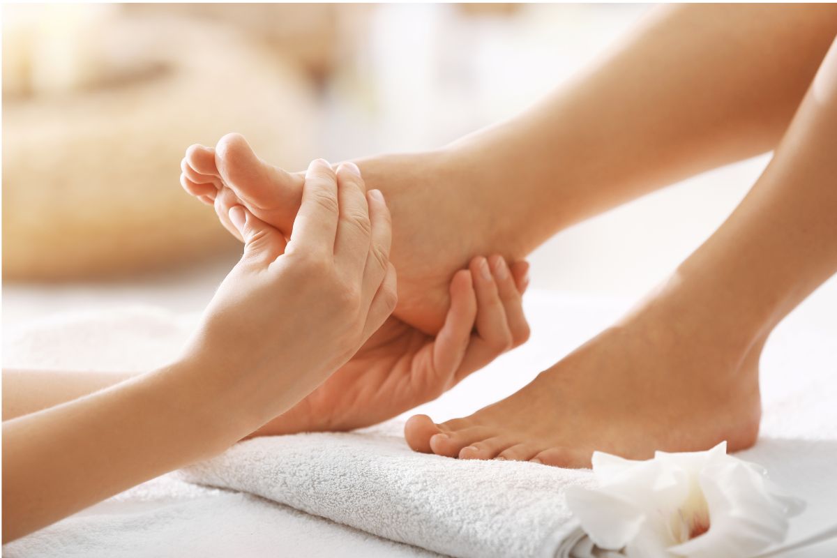 Foot spa treatment with a therapist working on a guest's foot at an Upper East Side spa